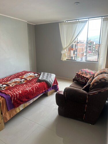 Travel's _house in Cupaca has a shared living room and kitchen. For all V