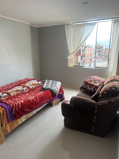 Travel's _house in Cupaca has a shared living room and kitchen. For all V