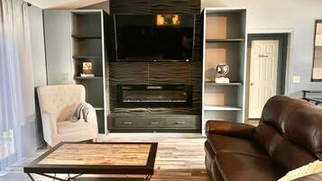 Smart TV, fireplace, books