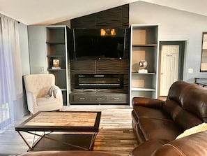 Smart TV, fireplace, books