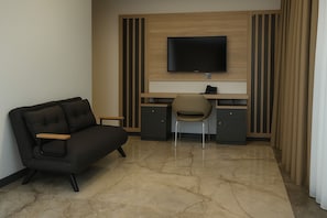 Habitación ejecutiva | Ropa de cama de alta calidad y minibar