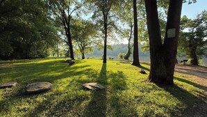 A park with benches, trees, and a lake. - A peaceful, forest retreat with stunning views near historic Harpers Ferry. (Harpers Ferry)