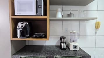 Comfort Apartment | Private kitchen | Coffee/tea maker, dining tables
