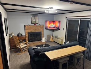 Smart TV, fireplace, books