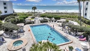 A swimming pool with a view of the beach and ocean. - Luxurious 2BR/2BA Gulf-front Boca Grande condo (Boca Grande)