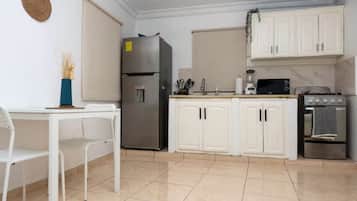 Apartment (#8) | Private kitchen | Stovetop, dishwasher, cookware/dishes/utensils