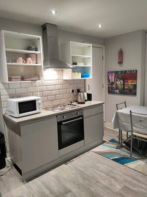 Microwave, oven, electric kettle, dining tables
