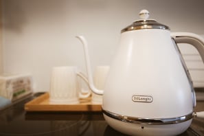 Mini-fridge, microwave, stovetop, cookware/dishes/utensils