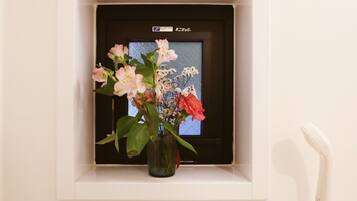 Combined shower/tub, free toiletries, hair dryer, slippers