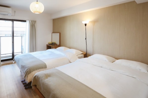 Memory foam beds, desk, laptop workspace, blackout drapes