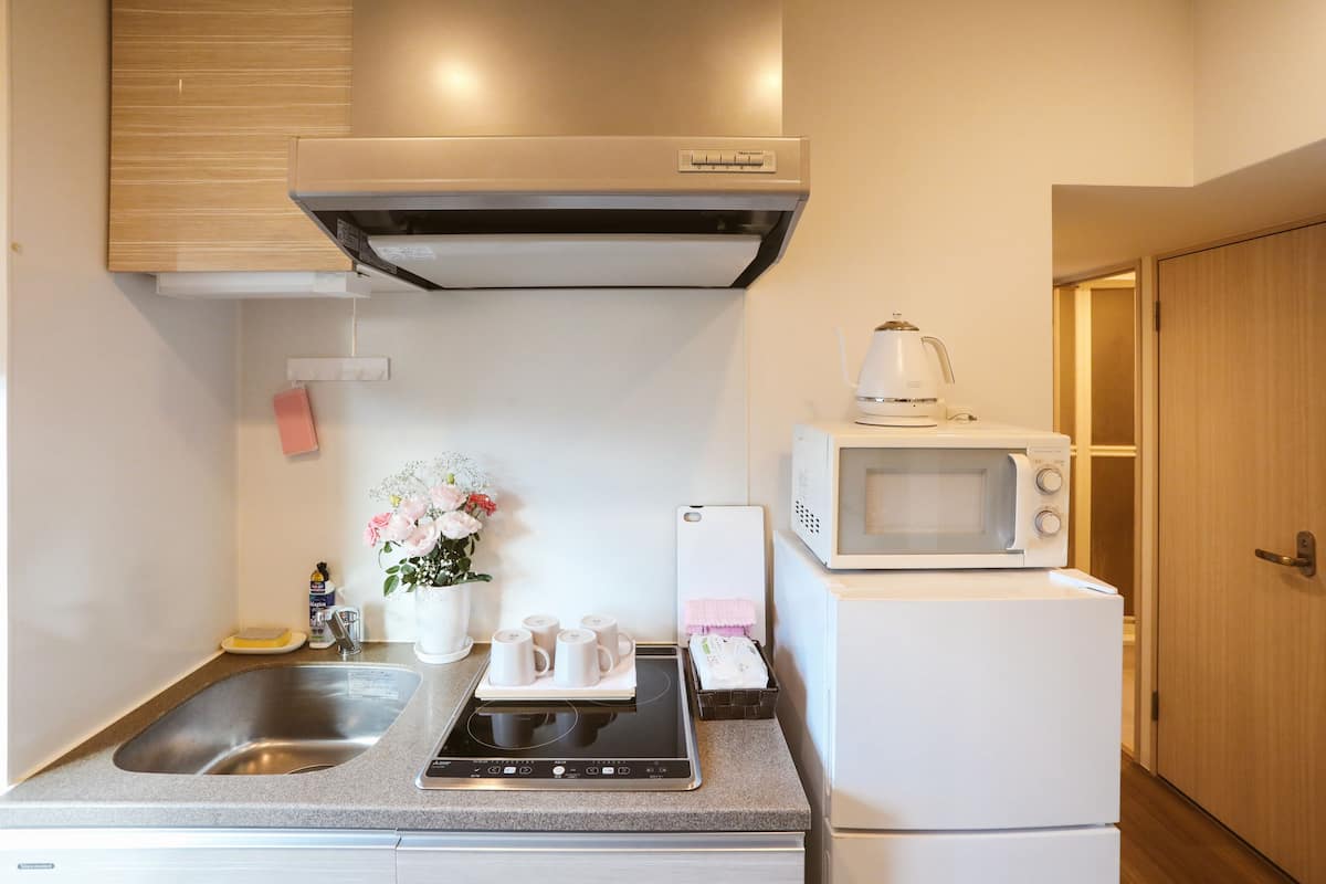 Mini-fridge, microwave, stovetop, cookware/dishes/utensils