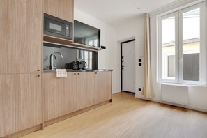 Fridge, microwave, stovetop, coffee/tea maker