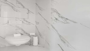 A bathroom with a toilet, a mirror, and marble-patterned walls.