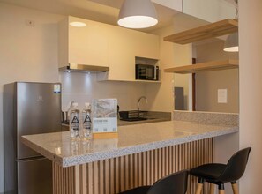 Fridge, microwave, stovetop, coffee/tea maker