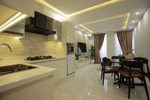 Deluxe-Suite, 1 Schlafzimmer | Wohnbereich