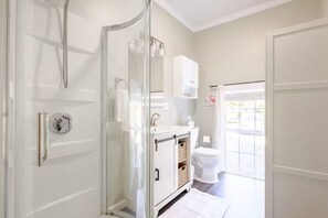Shower, hair dryer, towels, soap