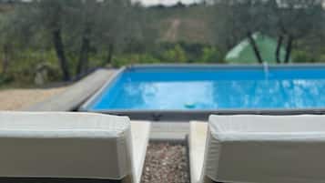 Seasonal outdoor pool, pool umbrellas, pool loungers
