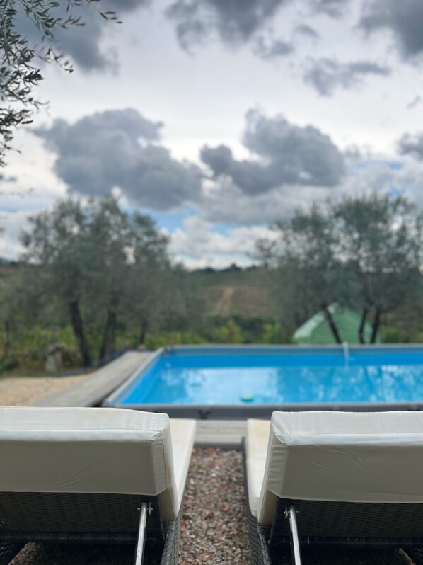 Seasonal outdoor pool, pool umbrellas, pool loungers