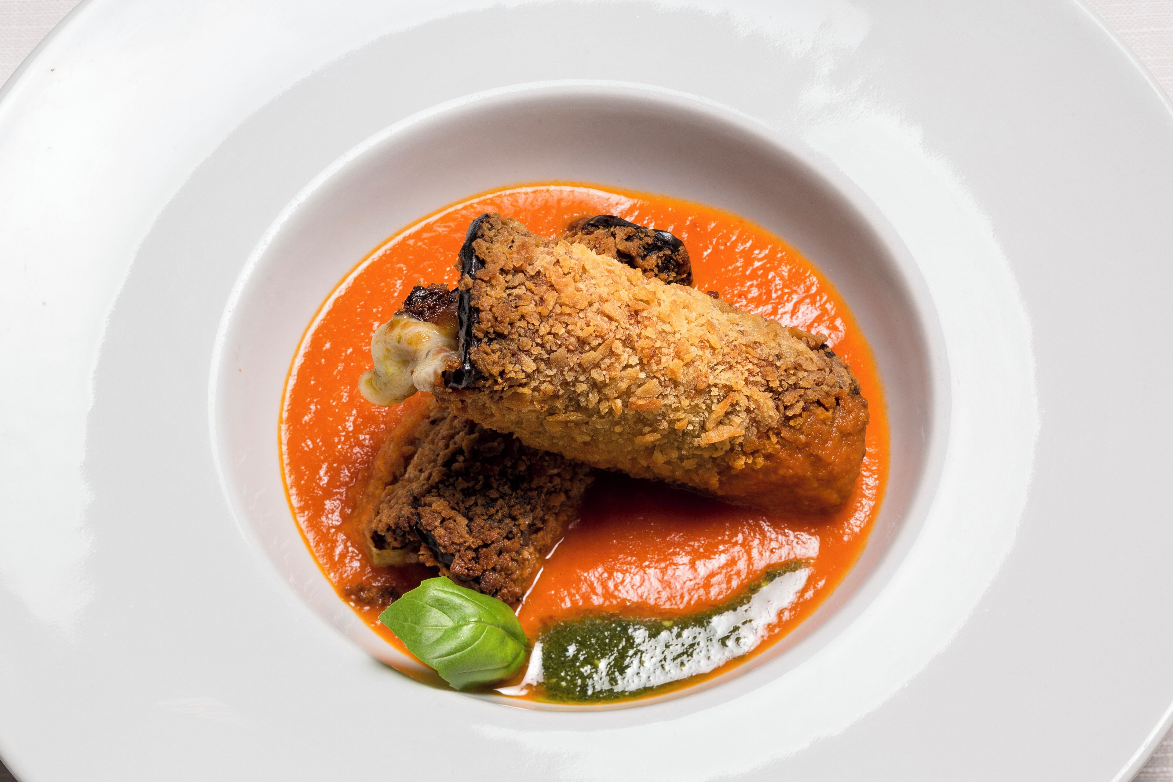 A white plate with a food dish.