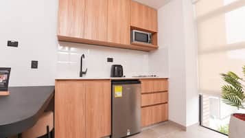 Microwave, stovetop, coffee/tea maker, cookware/dishes/utensils