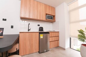 Microwave, stovetop, coffee/tea maker, cookware/dishes/utensils