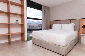 1 bedroom, desk, iron/ironing board, travel cot