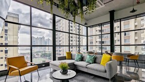 A modern living room with a sofa, chairs, and a coffee table.