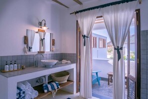 Comfort Suite, 1 King Bed, Partial Sea View | Bathroom | Hair dryer, bathrobes, slippers, soap