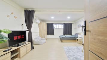 Luxury Studio Suite, Patio, City View | Desk, laptop workspace, blackout drapes, free WiFi