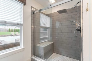 Shower, hair dryer, towels, shampoo