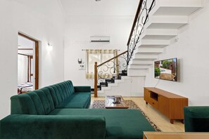 Luxury Condo, 2 Bedrooms, Pool View | Living area | 50-inch LED TV with digital channels, Netflix, streaming services - Goan Hideaway - Cuatro (Arpora)