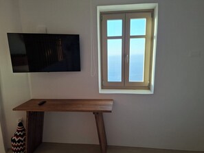 Suíte estúdio com design assinado, vista para o mar | Wi-Fi de cortesia