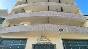 A multi-story hotel with balconies and a sign indicating it is Hotel Miguel in Playa del Carmen. - Hotel San Miguel Playa del Carmen (Playa del Carmen)