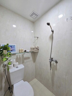 Shower, hair dryer, towels, soap