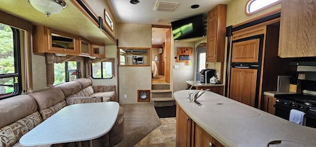 Fridge, microwave, oven, stovetop. A&J Country RV Getaway