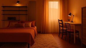 A bedroom with a bed, a desk with a chair, a lamp, and a shelf with a lamp. - Florence center apartment in former convent (Firenze)