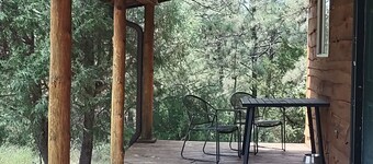 One of two rustic cabins nestled in Rosebud Sicangu Lakota Oyate pine forest.