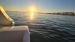 A waterfront view with buildings in the distance and a clear sky. - Prestige Beach Apartament Durres (Durres)