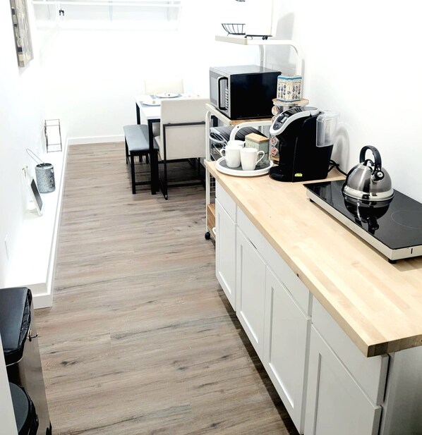 Fridge, microwave, stovetop, coffee/tea maker