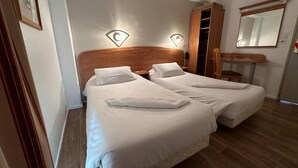 A double room with two beds, a wooden wardrobe, a mirror, and a small desk. - Havana (Malay-le-Grand)