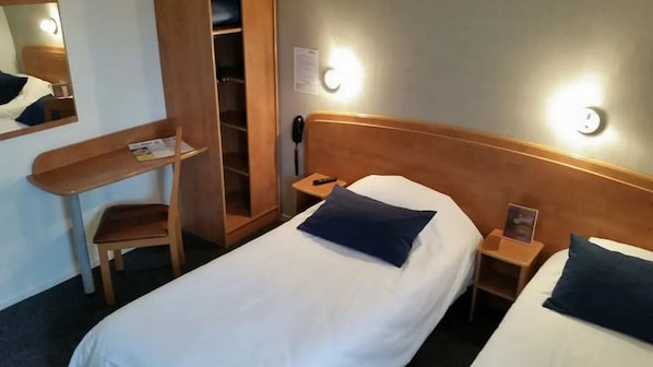 Premium bedding, in-room safe, laptop workspace, soundproofing