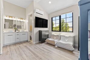 A modern bathroom with a vanity, mirror, and built-in shower. - Brand New Home! Its about time to have a beautiful pool area, spacious 7 bedroom home. (Hurricane)