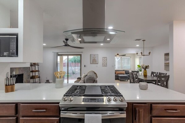 Fridge, microwave, stovetop, coffee/tea maker