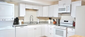 3-bed/2 bath basement apt. in charming Midvale with AC, wifi, laundry & hot tub.