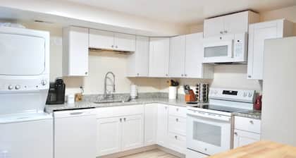 3-bed/2 bath basement apt. in charming Midvale with AC, wifi, laundry & hot tub.