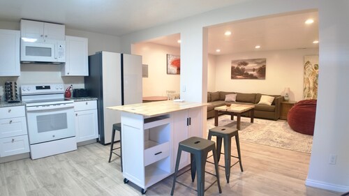 3-bed/2 bath basement apt. in charming Midvale with AC, wifi, laundry & hot tub.