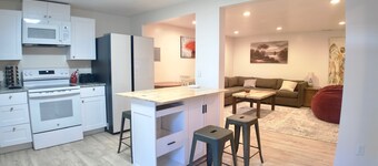 3-bed/2 bath basement apt. in charming Midvale with AC, wifi, laundry & hot tub.