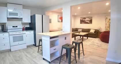 3-bed/2 bath basement apt. in charming Midvale with AC, wifi, laundry & hot tub.