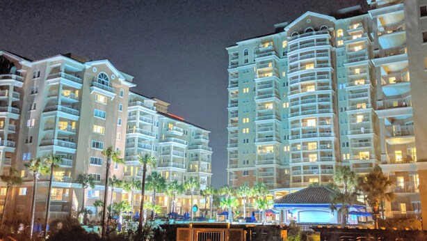 A multi-story hotel with balconies, palm trees, and a pool area. - Myrtle Beach's Marriott Vacation Club, spacious 2BR, 2BA villas, ocean view
 (Myrtle Beach)