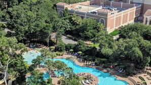 A resort with a large pool area surrounded by lush greenery, a beach view, and a building with a tower. - Myrtle Beach's Marriott Vacation Club, spacious 2BR, 2BA villas, ocean view
 (Myrtle Beach)